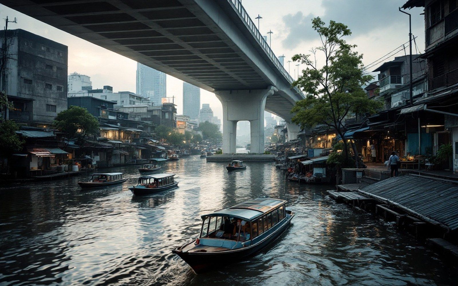 A wide river through a city at first light, boats moving